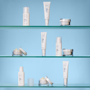 A white tube packaging of Obagi Hydrate Lightweight Moisturiser, alongside other Obagi products