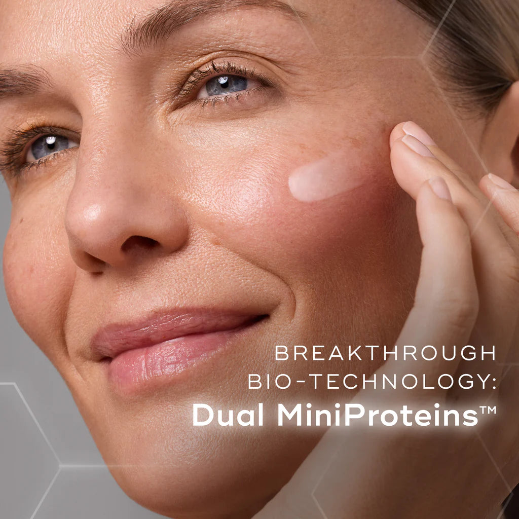 Close-up of a woman's face with a product application, featuring text about Dual MiniProteins.