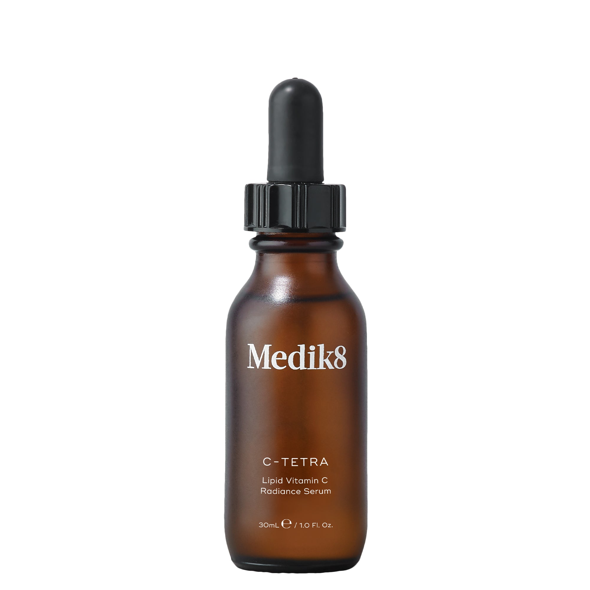 A brown glass bottle with a black dropper labeled Medik8 C-Tetra Liquid Vitamin C Radiance Serum, containing 30ml of product.