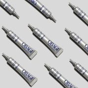 Obagi medical tubes arranged on a light gray background