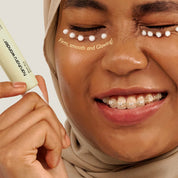 Woman applying a skincare product with text 'Firm, smooth and glowing' on her face.