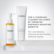 A pump bottle of Medik8 Lipid-Balance Cleansing Oil against a white background, alongside a tube of Medik8 Surface Radiance Cleanse 