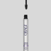 Obagi Nu-Cil eyebrow serum with applicator on a gray background