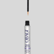 Obagi Nu-Gil eyelash enhancing serum bottle with applicator on a gray background