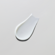 White ceramic spoon rest on a light gray background
