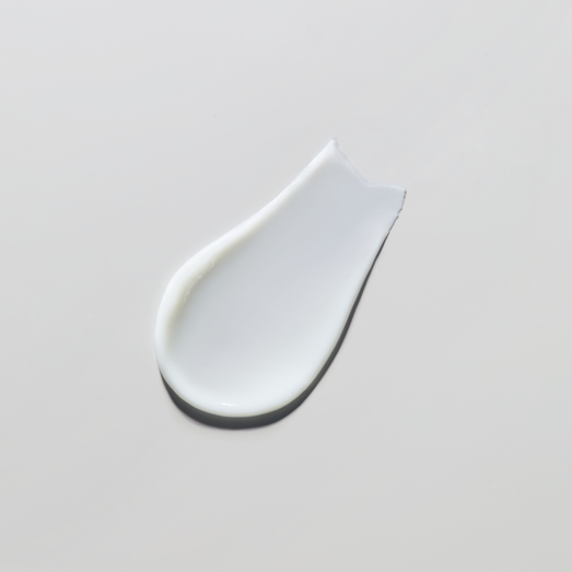 White ceramic spoon rest on a light gray background