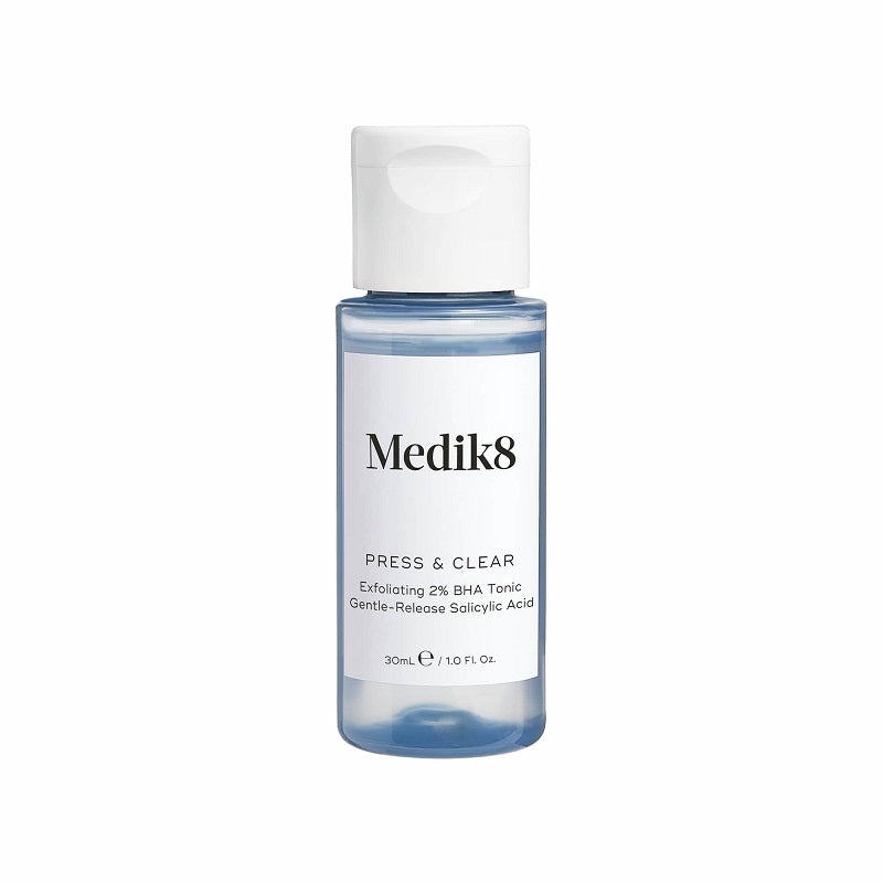 A bottle of Medik8 Press & Clear Gentle Detoxifying Toner with a white cap and label.