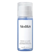 A pump bottle of Medik8 Press & Clear exfoliating toner with 2% BHA.